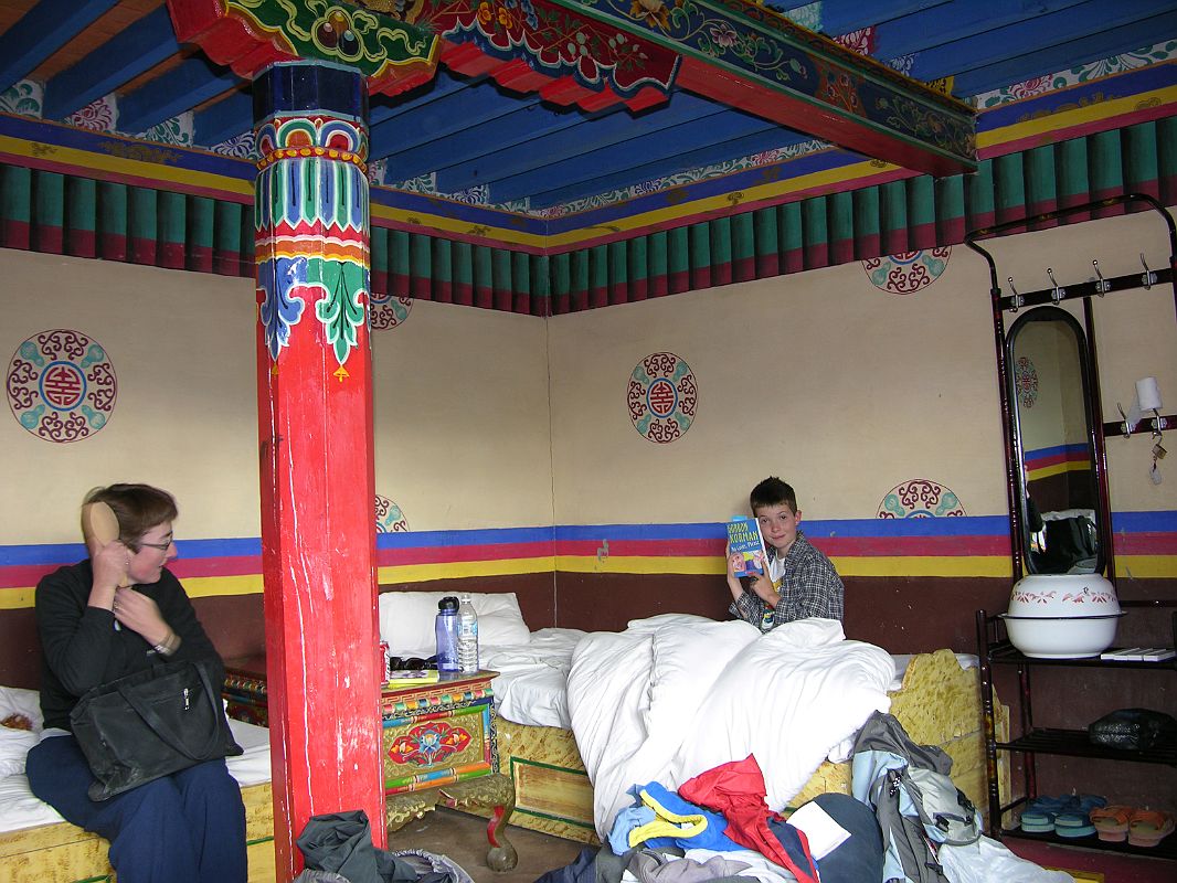 14 Charlotte Ryan And Peter Ryan In Tingri Everest Snow Leopard Hotel Room In 2005 Charlotte Ryan and Peter Ryan relax in the Everest Snow Leopard Hotel in Tingri in 2005. It has clean unheated rooms and a shared, very clean squat toilet. It also has solar-heated showers.